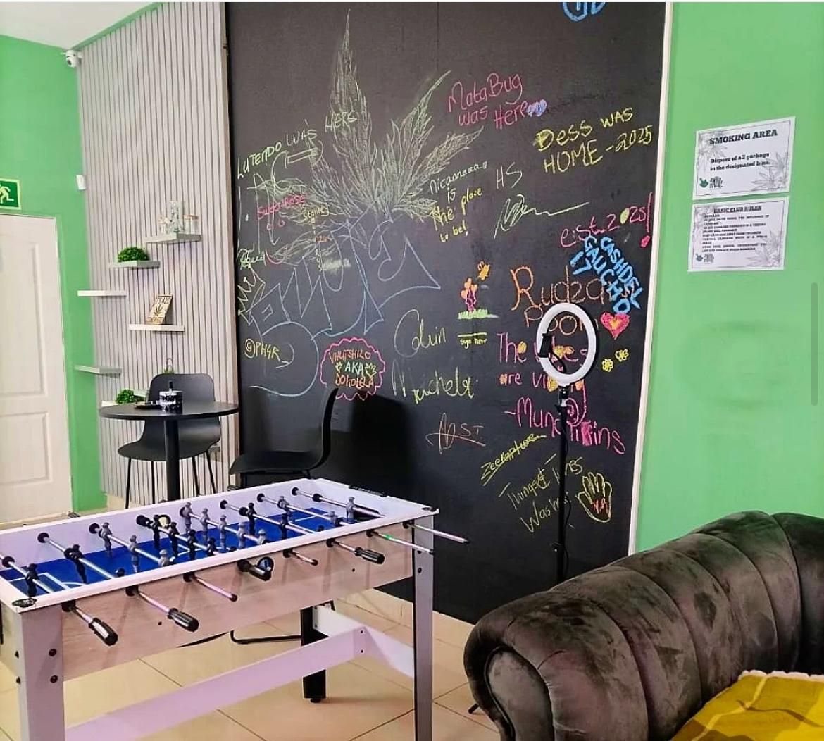 Niacanna cannabis lounge in Pretoria North with chalk signature wall and foosball table